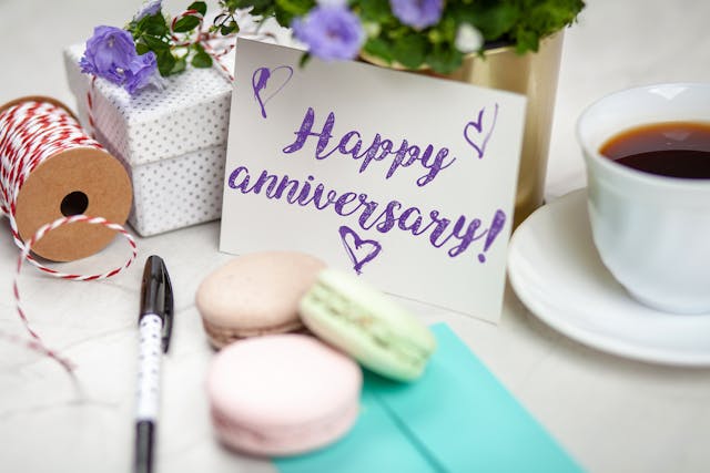happy anniversary signage with flower gifts