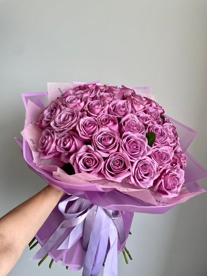 Fifty purple roses