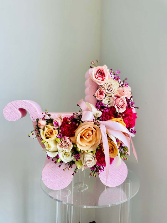 Floral Arrangement in a Stroller Shape Box for a Newborn