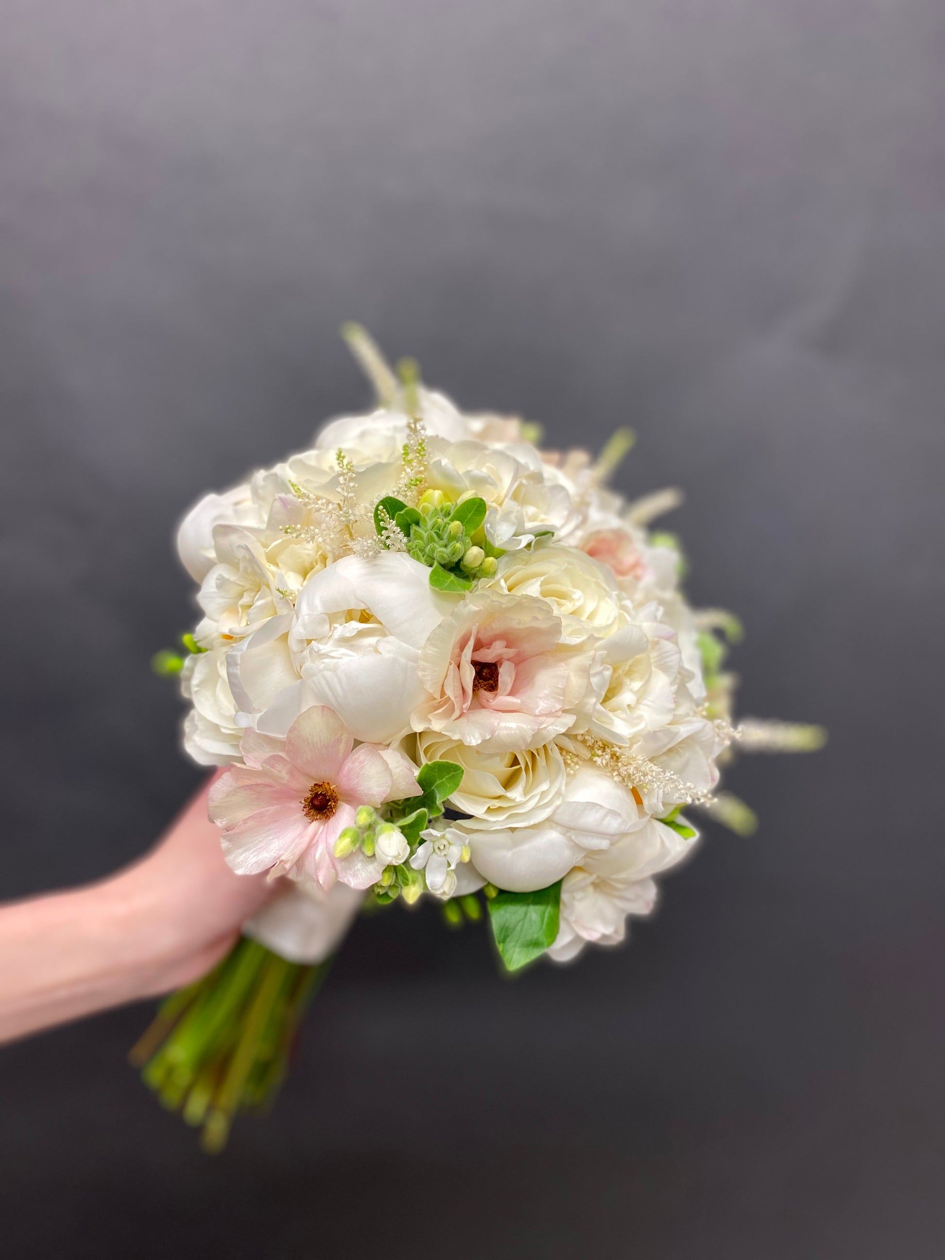 Bridal Bouquet with butterfly ranunculus and peonies